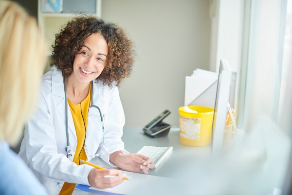 image of a doctor speaking to a patient