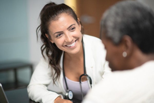 image of a doctor speaking to a patient